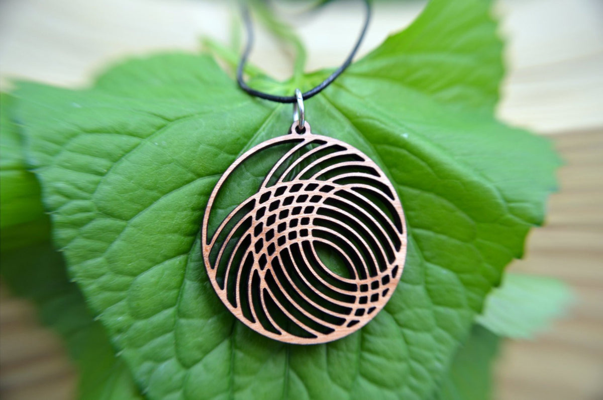 Interlocking Circles Pendant in cherry on leather cord - YuppyCollections