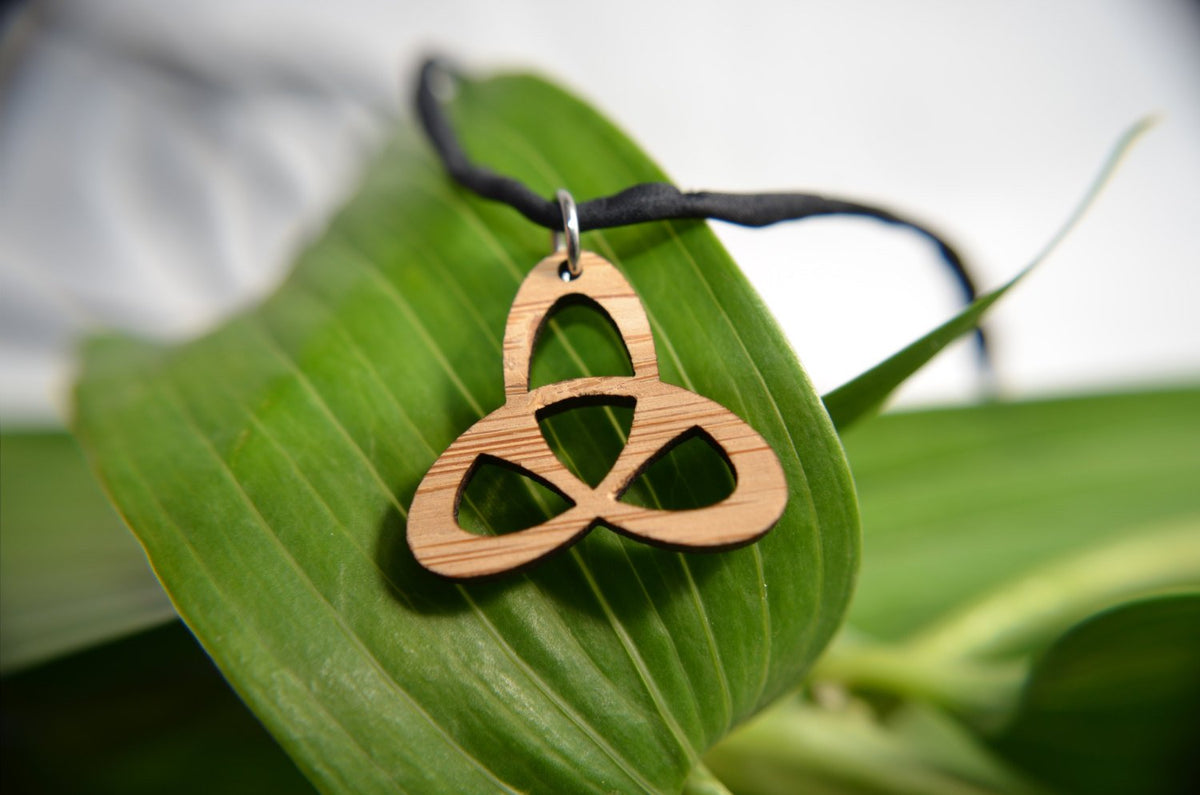 Celtic Trinity Knot Pendant in cherry on leather cord - YuppyCollections